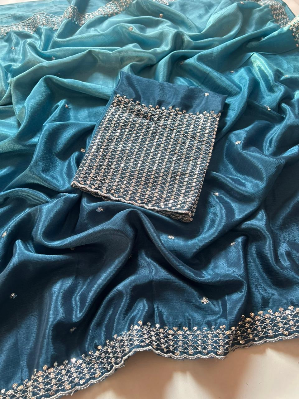 Soft Chinnon Saree With Heavy Embroidery work And Jari Work And Border