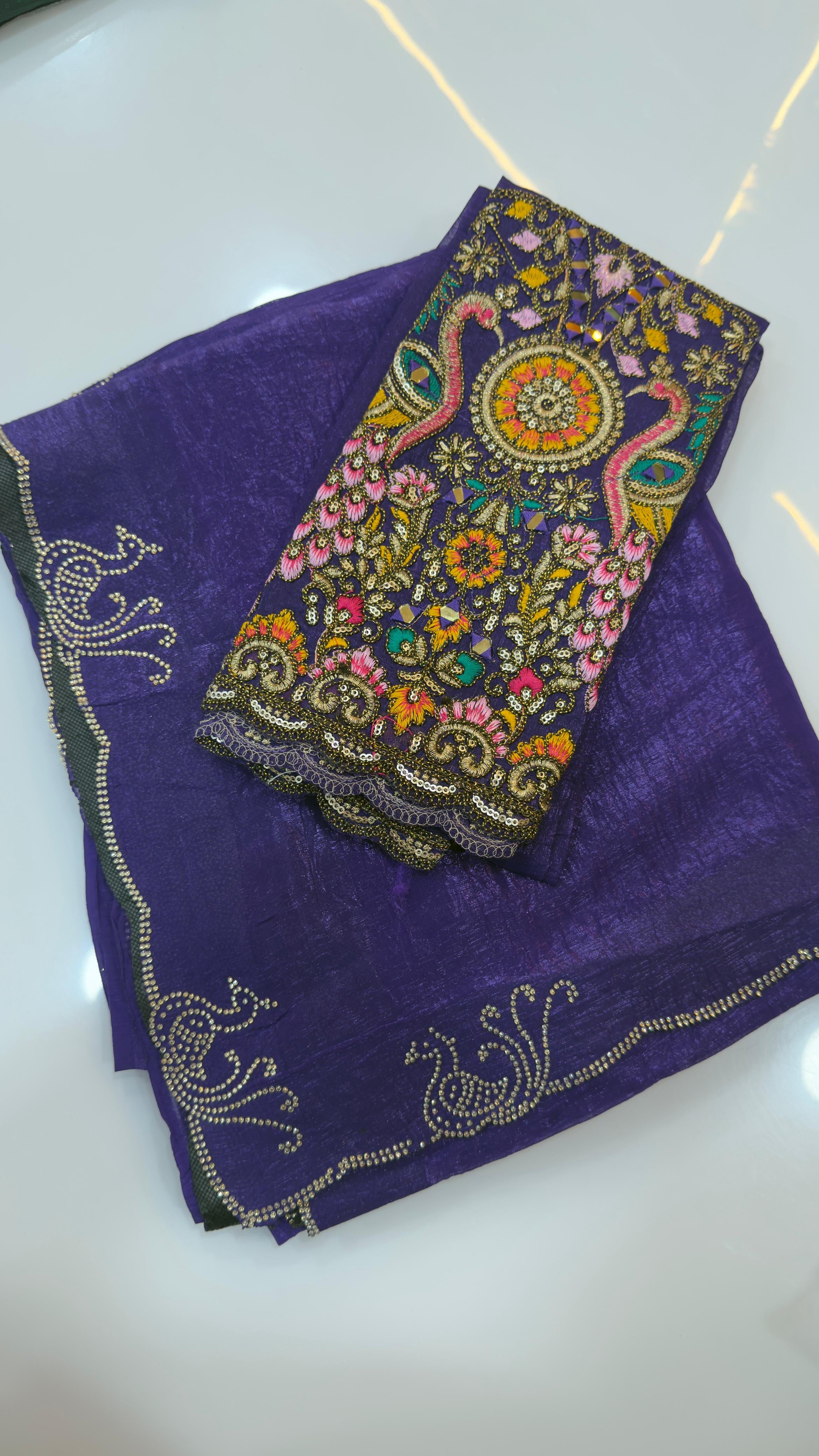 Fendy silk sarees with peacock design swaroshki stones across the border