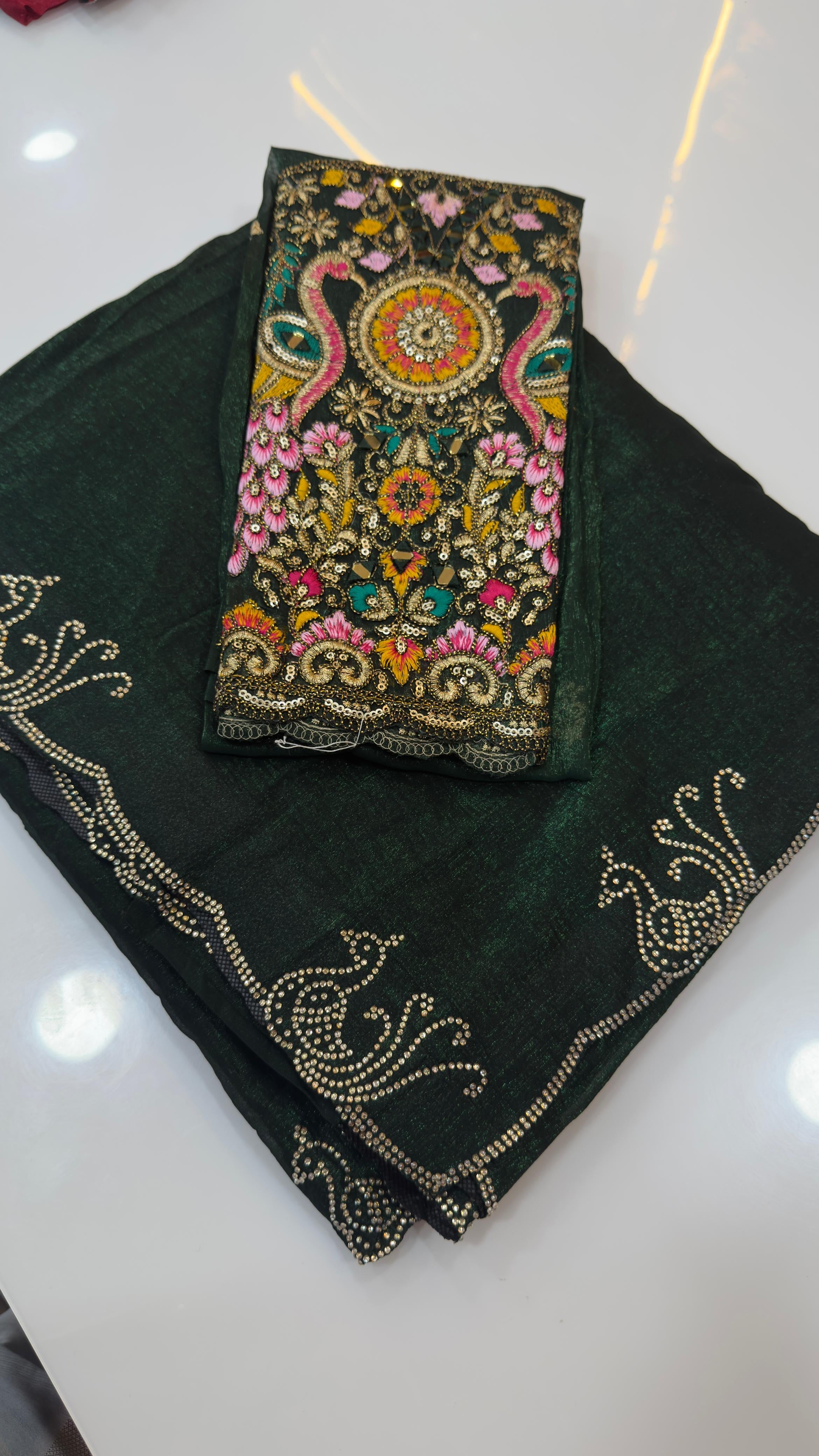 Fendy silk sarees with peacock design swaroshki stones across the border
