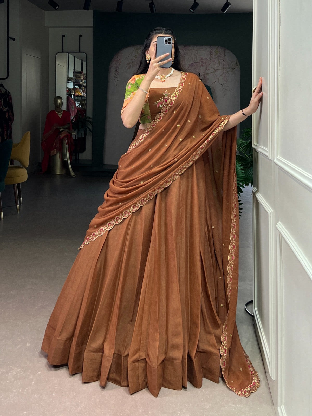 Combining traditional embroidery with the richness of chocolate crush fabric Lehenga choli