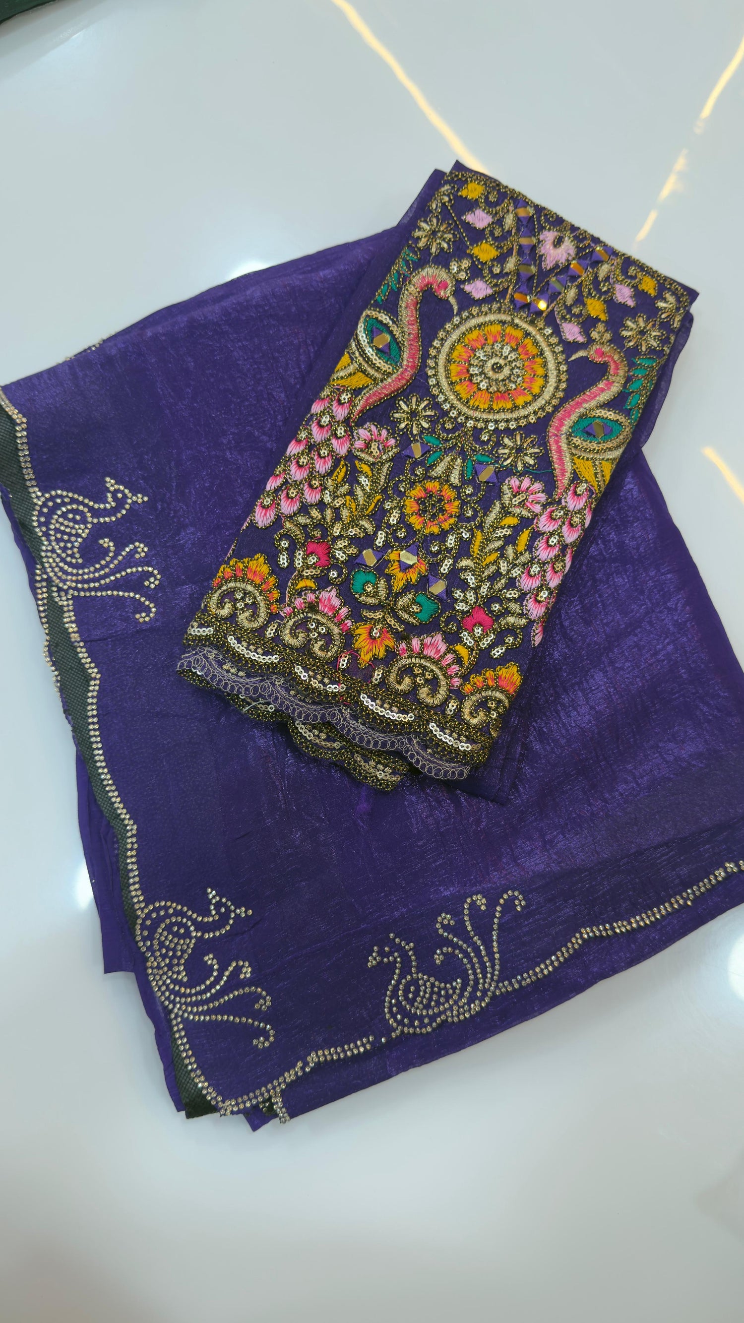 Fendy silk sarees with peacock design swaroshki stones across the border