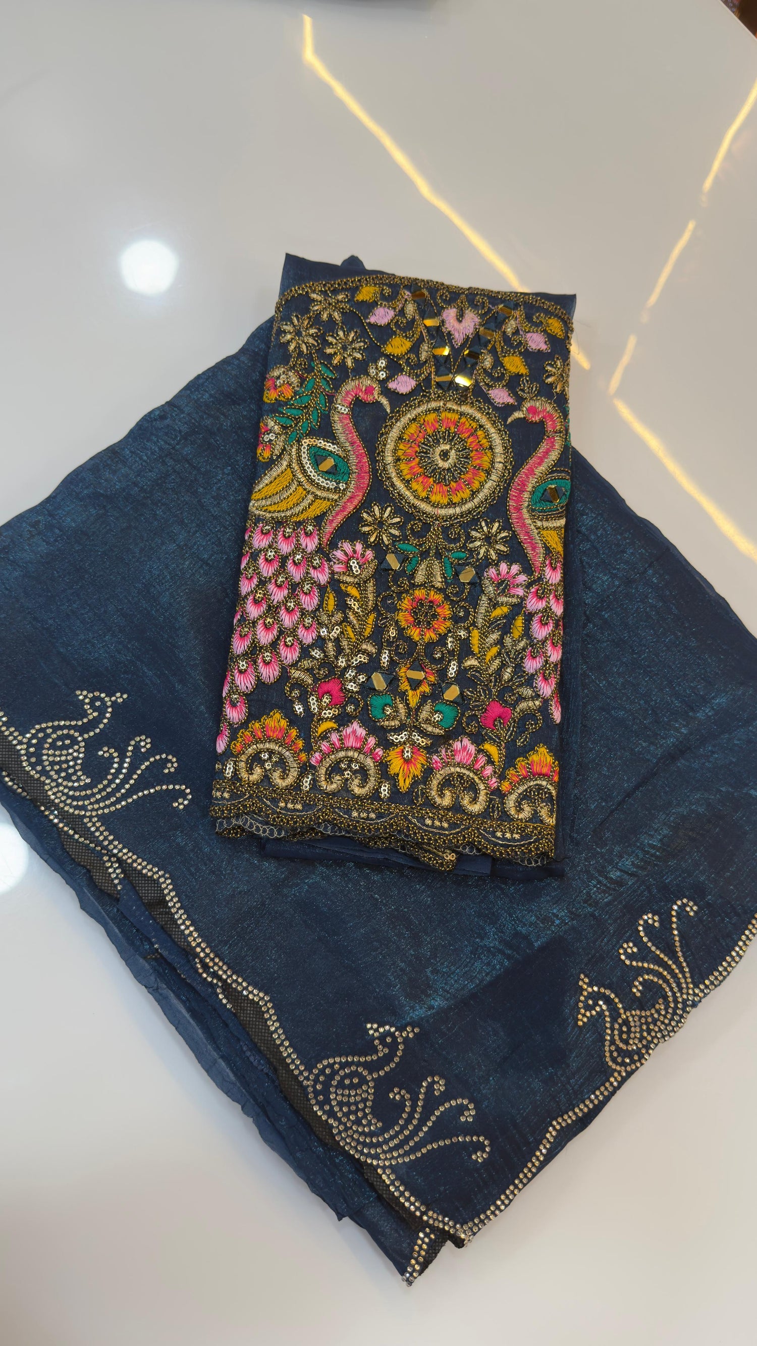 Fendy silk sarees with peacock design swaroshki stones across the border