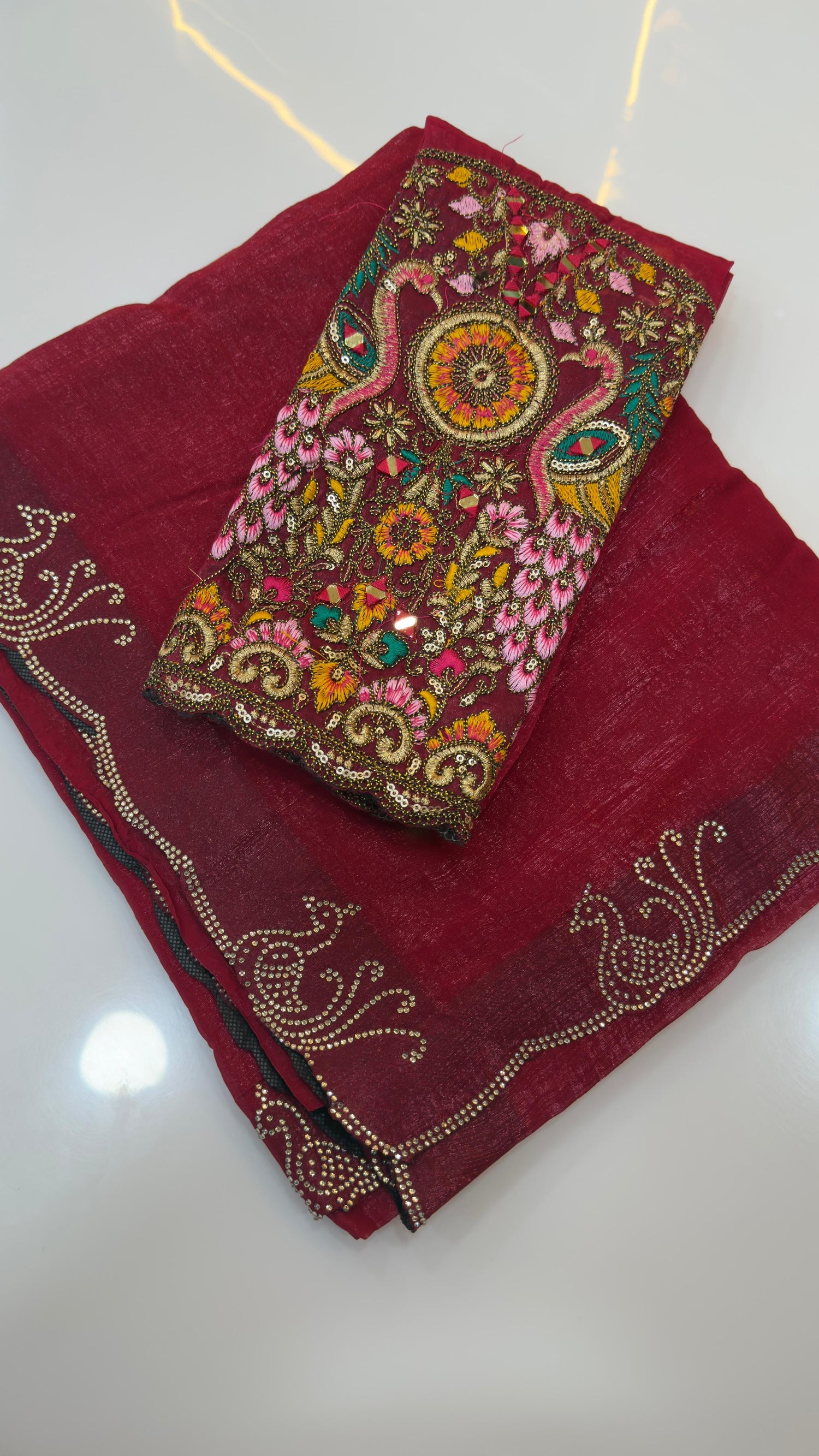 Fendy silk sarees with peacock design swaroshki stones across the border