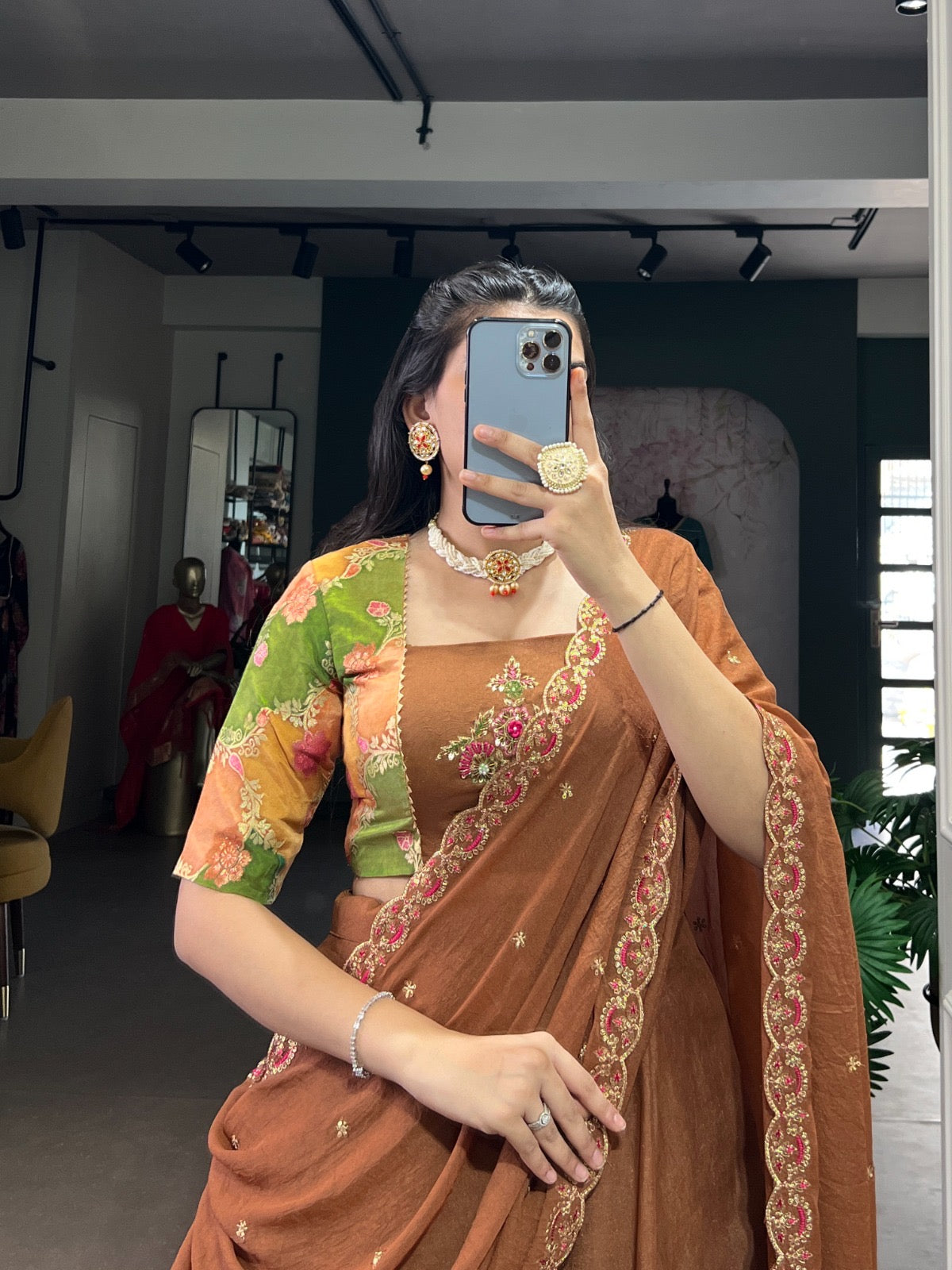 Combining traditional embroidery with the richness of chocolate crush fabric Lehenga choli